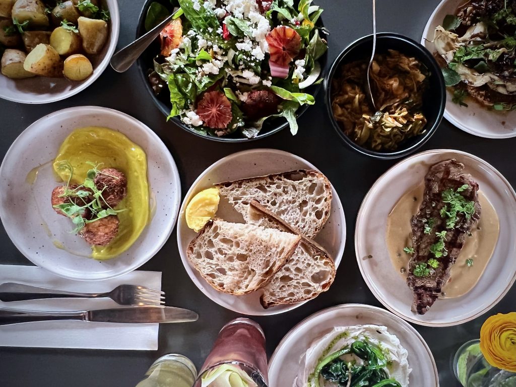 Table of food on a city food tour