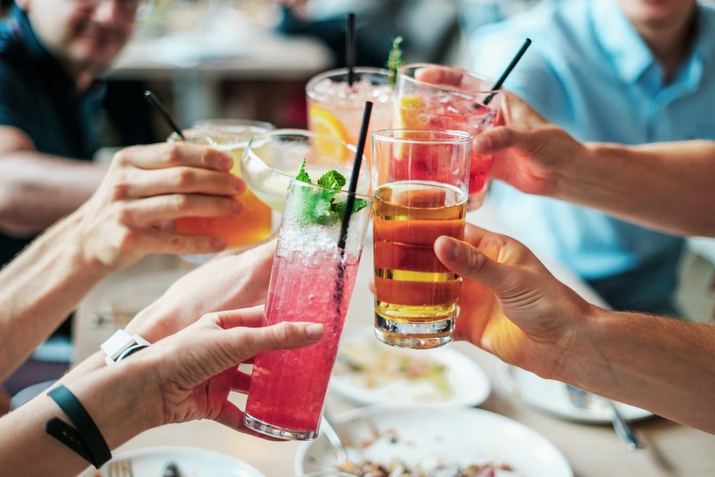 Cheers, Group of friends toasting cheers in a restaurant