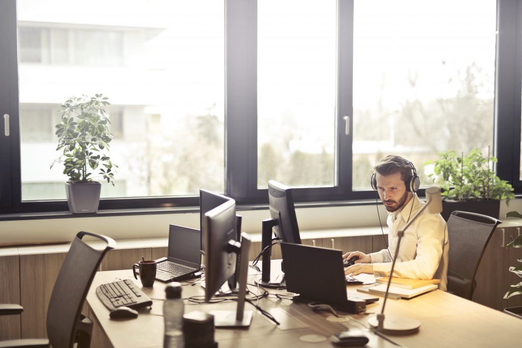 Man in office working on a laptop