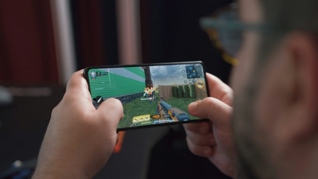 A man playing a mobile game