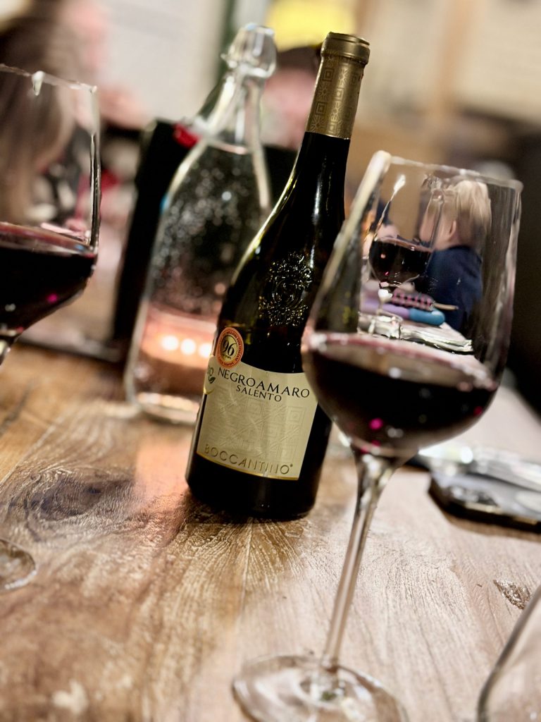 Red wine on the table at The Fleece Countryside Inn in Barkisland near Ripponden, creating a warm and elegant atmosphere for Sunday lunch in Calderdale