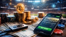 Professional, high-end photograph of a smartphone displaying live sports betting odds surrounded by stacked coins and digital currency symbols inside a floodlit stadium, representing cryptocurrency-powered sports betting in 2026.