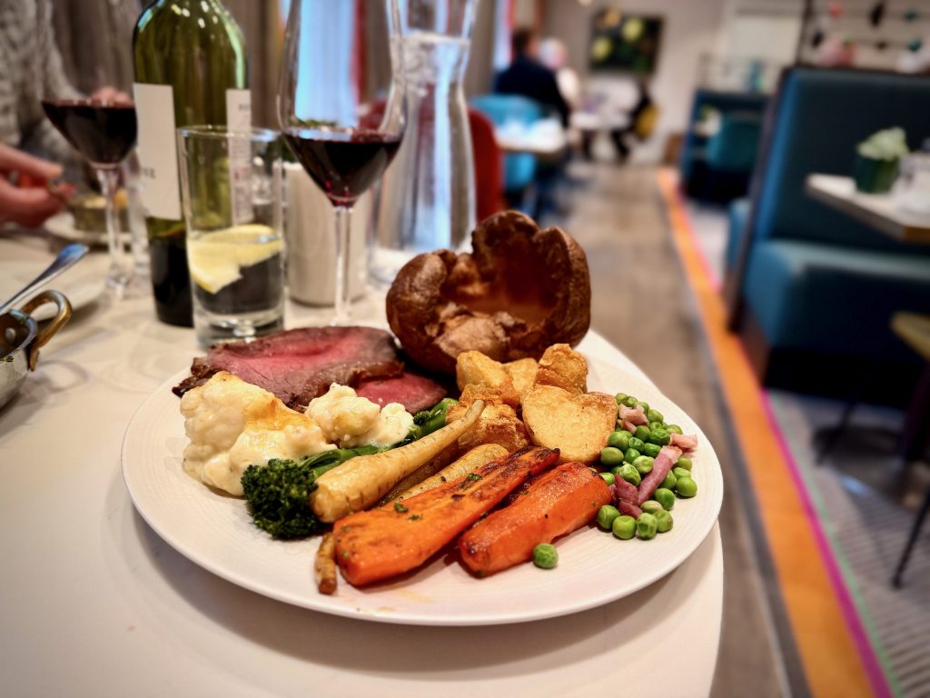 Roast Aberdeen Angus beef with Yorkshire pudding, roast potatoes, seasonal vegetables and cauliflower cheese at Clocktower Restaurant, Rudding Park