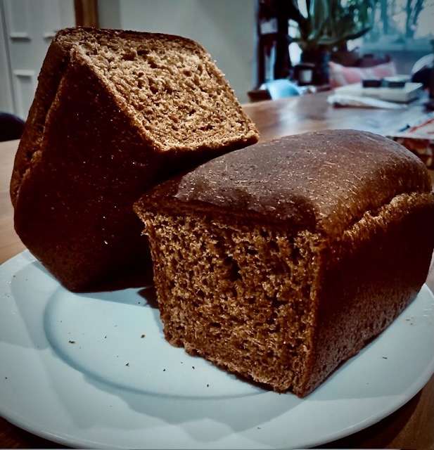 Homemade Polish rye bread loaves cooling after baking with dark crust and dense crumb