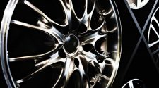 Close-up of polished 18 inch alloy wheels with multi-spoke design on display in showroom