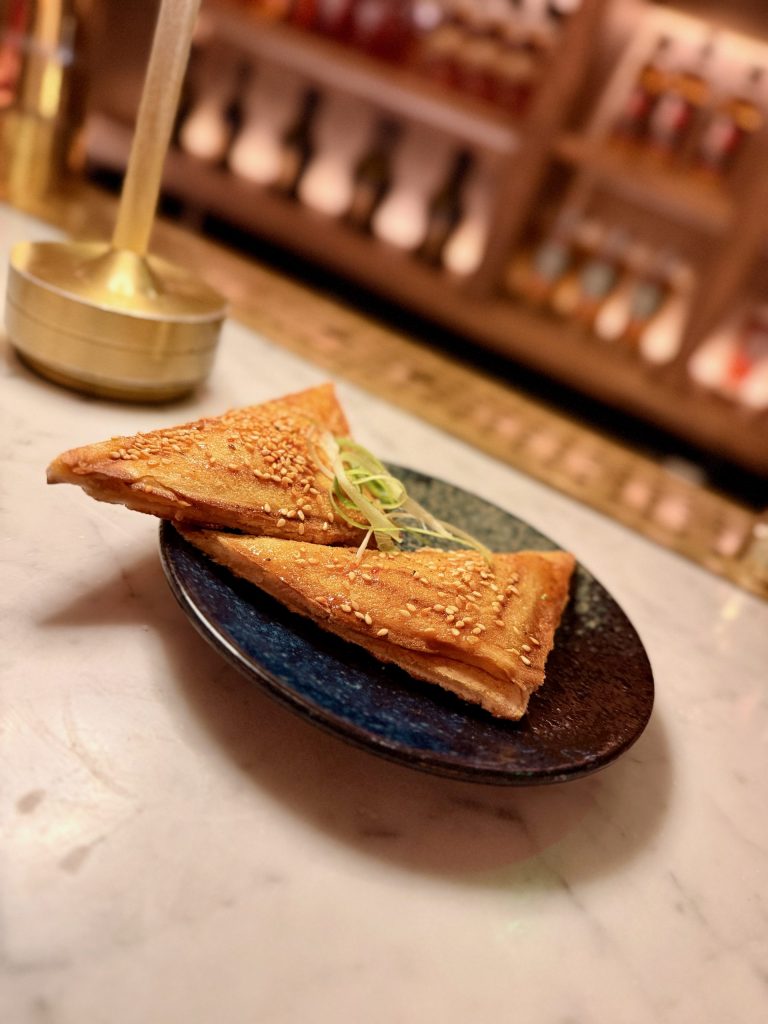 Kimcheese toastie with sesame seeds and spring onion at FOWL restaurant near Piccadilly Circus London