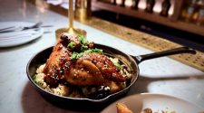 Rotisserie half chicken with shiitake rice, sesame seeds and green chilli served at FOWL restaurant in London