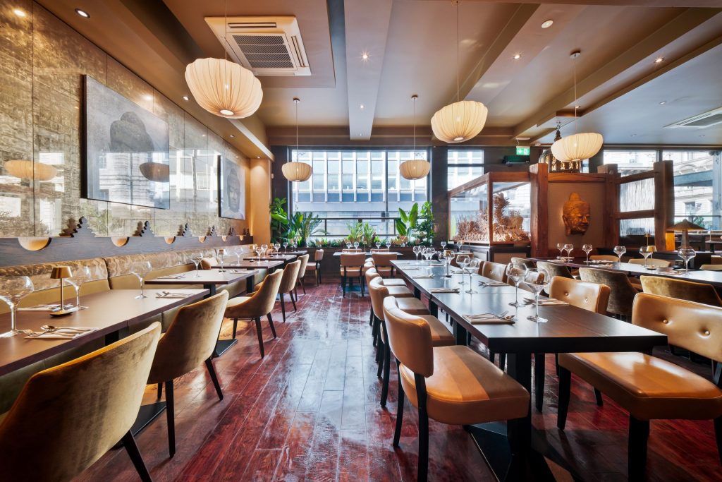 The main dining room at Sukhothai South Parade in Leeds showing the refurbished interior, warm lighting and stylish seating