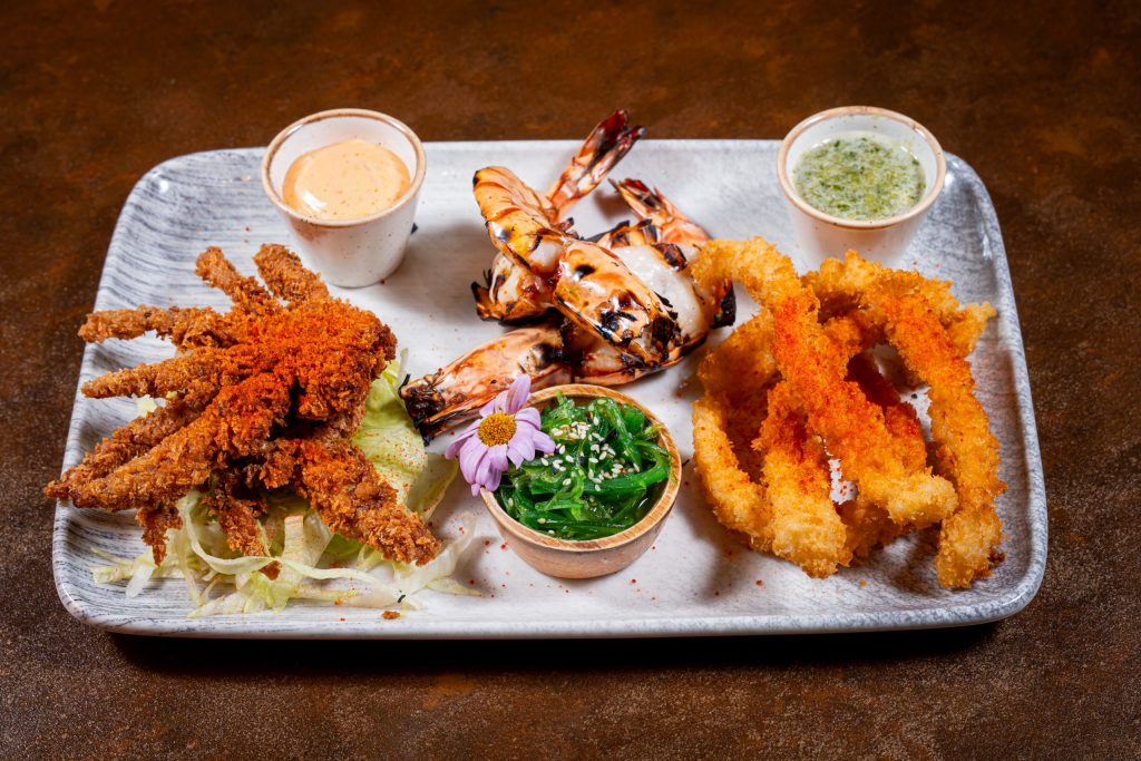 A seafood platter at Sukhothai South Parade in Leeds with crispy squid, grilled prawns, soft-shell crab and dipping sauces