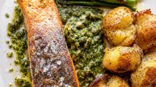Seared salmon with salsa verde, roasted new potatoes and Tenderstem broccoli – a healthy high-protein salmon dinner recipe with crispy skin salmon and fresh herb sauce.