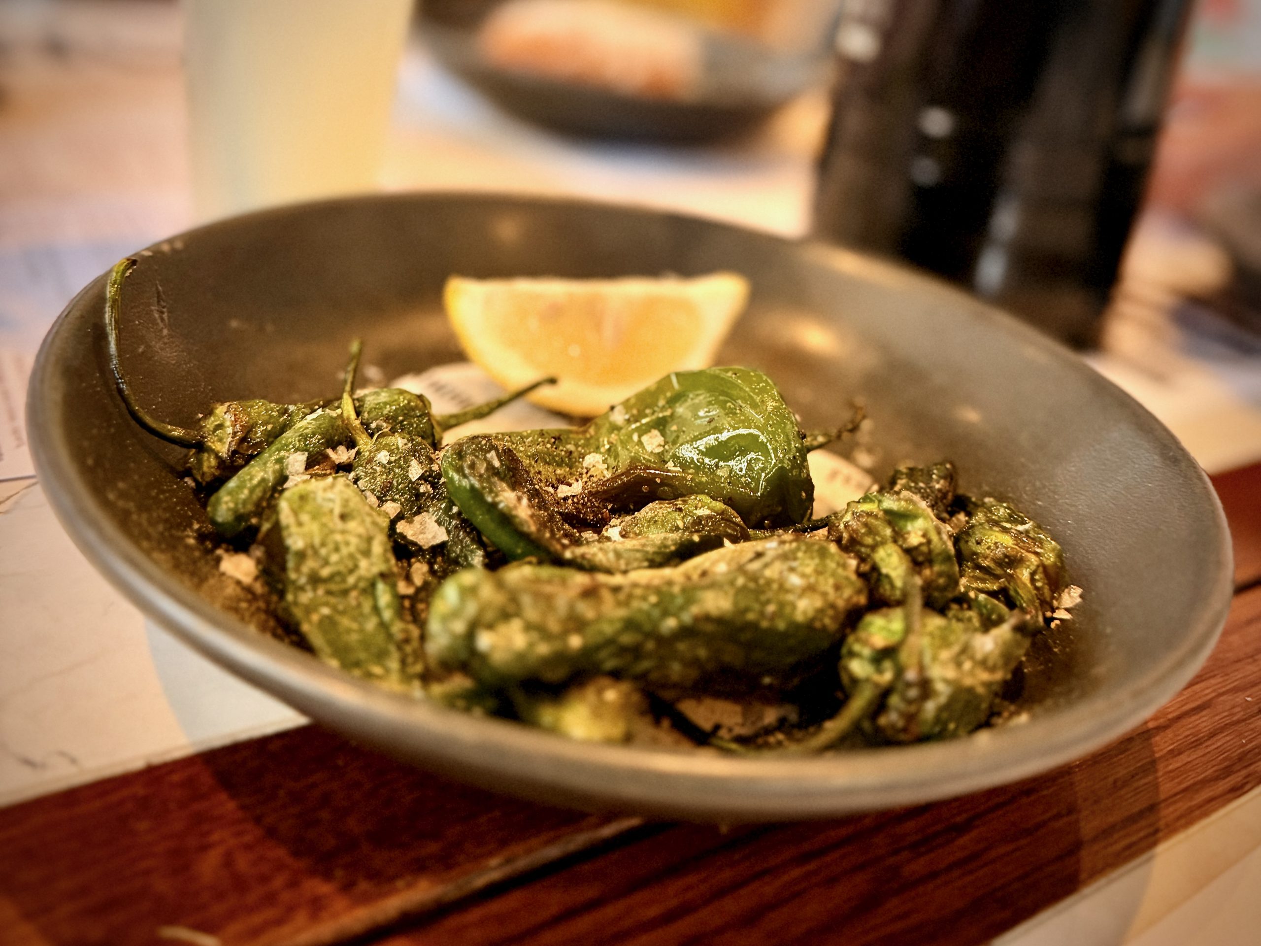 Lemon-dressed Padrón peppers with sea salt
