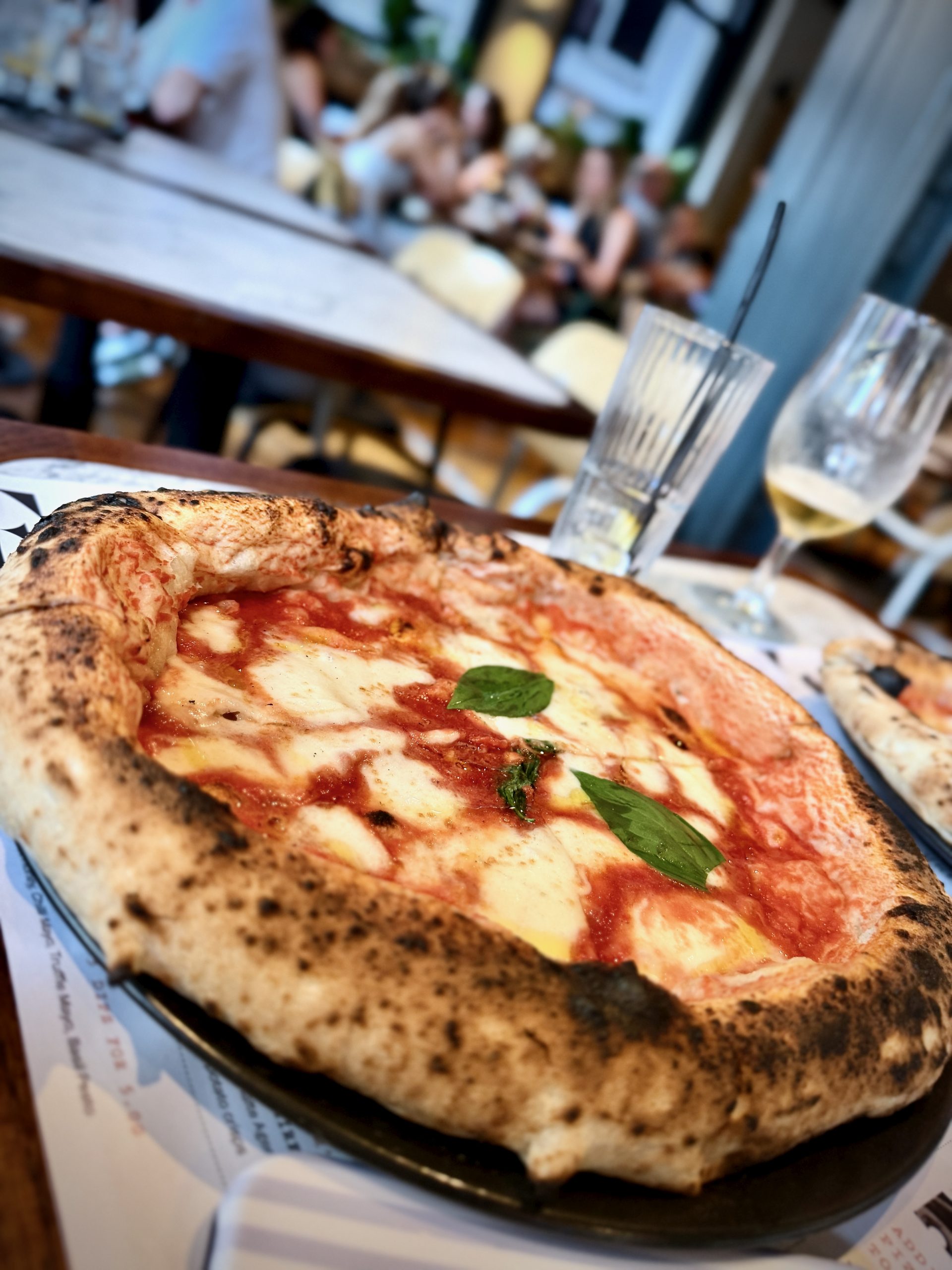 Neapolitan Margherita pizza with basil and blistered crust