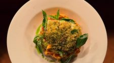 A plated pasta dish with herbed crumb fish, basil and tomato sauce served at Kendells Bistro in Leeds, ideal for a first date restaurant feature.