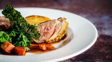 Sunday roast plate with sliced beef and greens for a Sunday roast vs Sunday carvery comparison