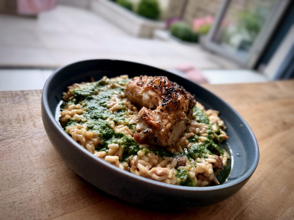 Roast chicken and wild mushroom risotto with Parmesan, lemon and green herb oil