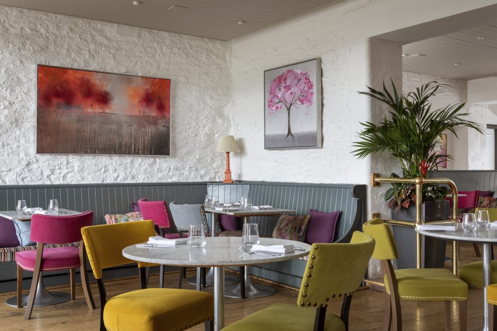 Colourful interior of The Brasserie restaurant at The Devonshire Arms Hotel and Spa.