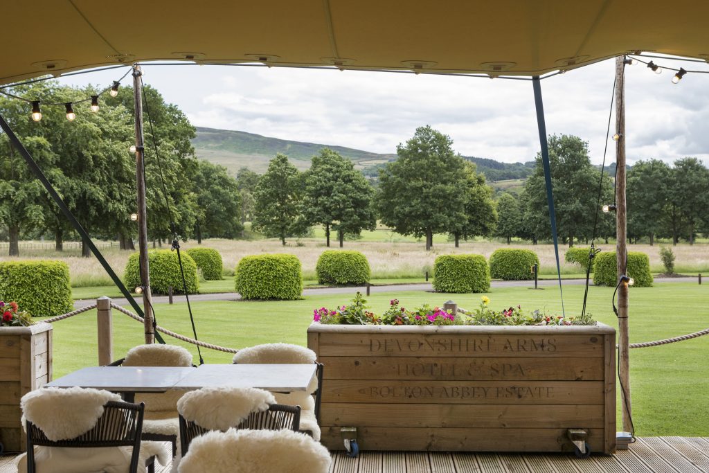 Outdoor terrace overlooking the gardens at The Devonshire Arms Hotel and Spa near Bolton Abbey