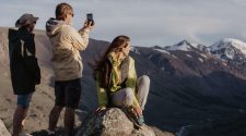 Digital nomads staying social while hiking in the mountains