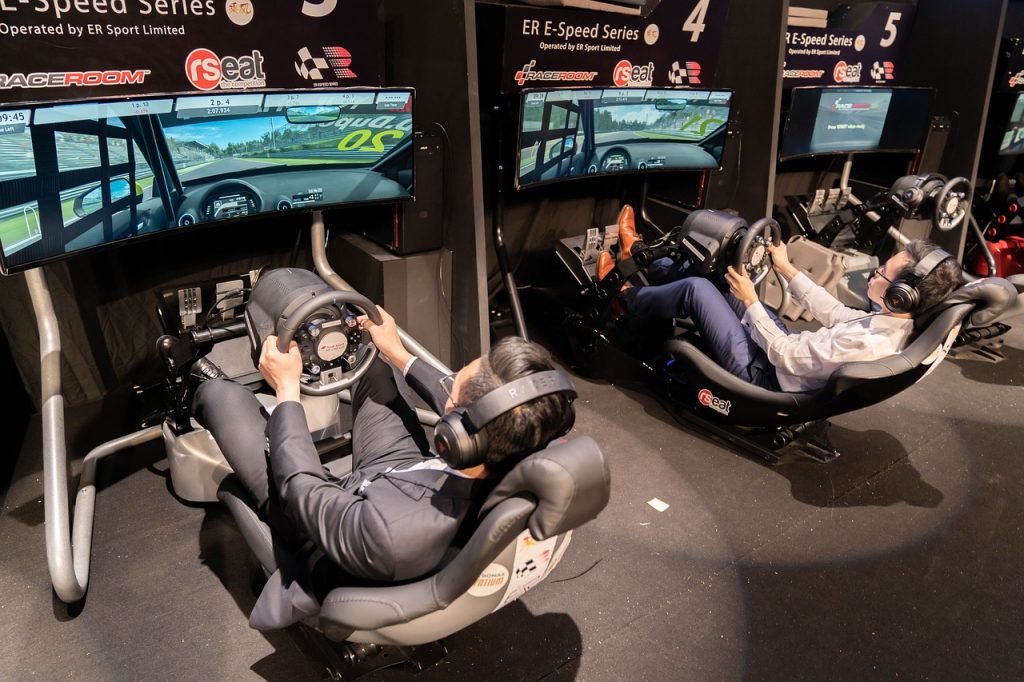 EPIC49 Kettering LAN players using racing simulator rigs