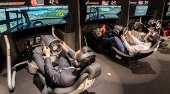 EPIC49 Kettering LAN players using racing simulator rigs