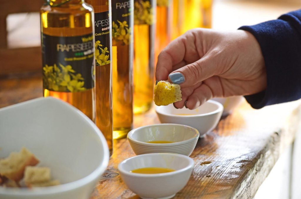 Visitor tasting Yorkshire rapeseed oil with bread at York Food and Drink Festival