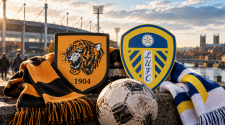 The emblems of two football clubs and a ball in front of the stadium