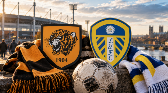 The emblems of two football clubs and a ball in front of the stadium