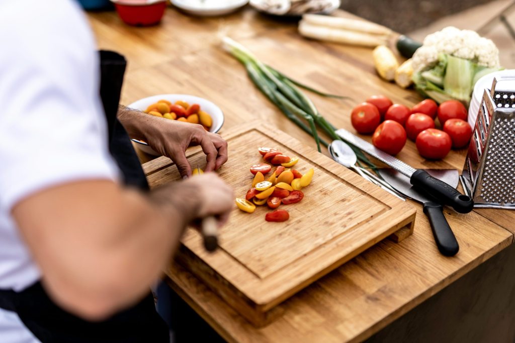Private chef preparing fresh ingredients for a personalised meal at home