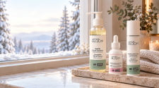 Flawless Bloom cleanser, brightening serum and moisturiser beside a snowy window