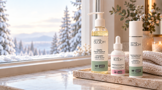 Flawless Bloom cleanser, brightening serum and moisturiser beside a snowy window