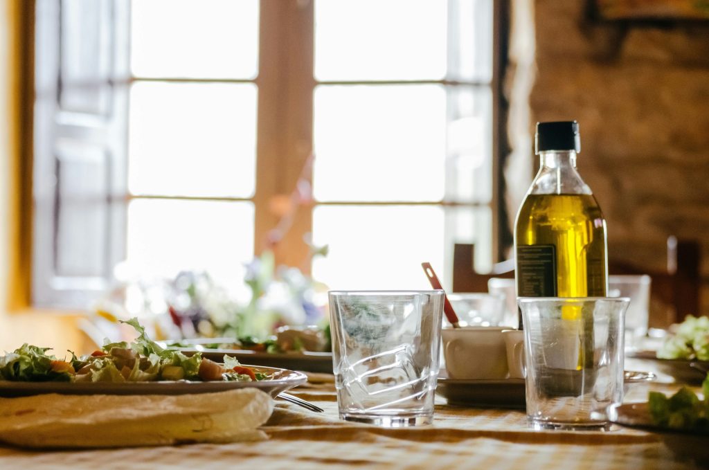Bottle of cooking oil on a kitchen table ready to be reused or disposed of safely