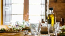 Bottle of cooking oil on a kitchen table ready to be reused or disposed of safely