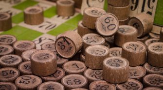 Numbered wooden bingo counters scattered across a bingo card